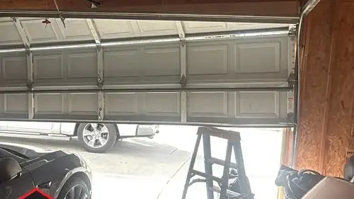 Why is my garage door crooked after attempting to open or close the door? Why is my garage door crooked after attempting to open or close the door?